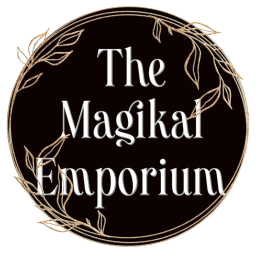 logo for the magikal emporium, a black moon with a gold filigree frame